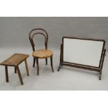 An early 20th century Bentwood child's chair, a stool and a toilet mirror. The mirror 60 cm wide.