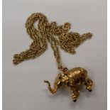 A 9 ct gold elephant form pendant on chain. The pendant 2 cm high (15.