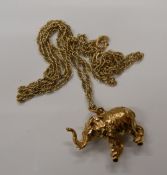 A 9 ct gold elephant form pendant on chain. The pendant 2 cm high (15.