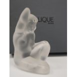 A boxed Lalique model of a nude female. 10 cm high.