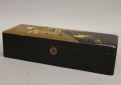 An early 20th century Japanese lacquered glove box. 30 cm wide.