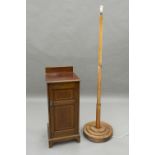 An Edwardian mahogany pot cupboard and a standard lamp. Pot cupboard 35.5 cm wide.