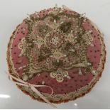 A Victorian beaded pin cushion. 16.5 cm diameter.