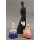 Three Royal Doulton figurines. The largest 30 cm high.
