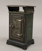 A Wright's Eureka No.410 gas stove oven tinplate money box. 13 cm high.