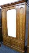 A Victorian mahogany mirrored door wardrobe. 145 cm wide.