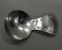 A Keswick Industrial School of Art caddy spoon. 7 cm long.