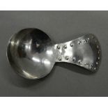 A Keswick Industrial School of Art caddy spoon. 7 cm long.