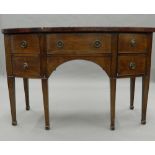 A bow front mahogany sideboard. 123 cm wide.