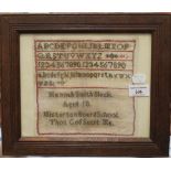 A framed sampler worked by Hannah Smith Slack, aged 10, of Misterton Board School.