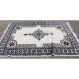 A Moroccan white ground rug. 183 cm wide.