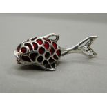 A silver pin cushion formed as a fish. 4.5 cm long.