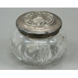 An American silver and cut glass dressing table jar. 7 cm high; 9 cm wide.