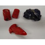 Two coral beads, a coral toad/frog and a lapiz carving. Lapiz 5.5 cm wide.