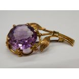 A 9 ct gold and amethyst brooch of floral form. 4.5 cm high (6.