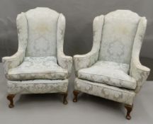 A pair of early 20th century upholstered armchairs. 91 cm wide.
