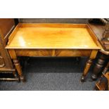 A Victorian mahogany two drawer side table. 105.5 cm wide.