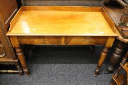 A Victorian mahogany two drawer side table. 105.5 cm wide.