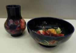 A Moorcroft bowl and a Moorcroft vase. The vase 12 cm high.