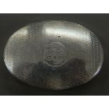 An oval silver snuff box inscribed V. S-S 13.4.52. 6.5 cm wide (45 grammes).