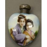 An early 20th century silver mounted heart shaped porcelain scent bottle. 5.5 cm high.