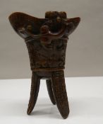 A libation cup. 11 cm high.