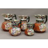 Five Masons Ironstone jugs. The largest 21 cm high.