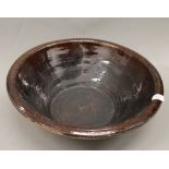 A large ceramic dairy bowl. 47 cm diameter.