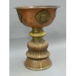 A large Tibetan engraved copper and brass vessel. 33 cm high.