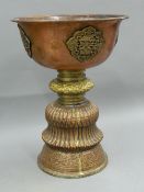 A large Tibetan engraved copper and brass vessel. 33 cm high.