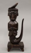 A tribal wooden carving of Mami Wata. 36 cm high.