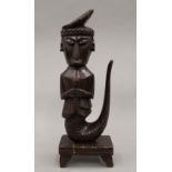 A tribal wooden carving of Mami Wata. 36 cm high.