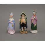 Three small porcelain figures. The largest 10 cm high.