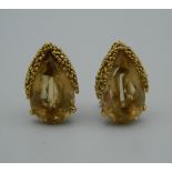 A pair of 18 K gold and topaz earrings. 2.25 cm high.