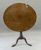 A mahogany tilt top tripod table. 83 cm wide.