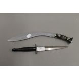A William Rogers of Sheffield Fairburn Sykes commando dagger and a kukri. The former 29.5 cm long.