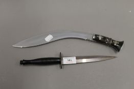 A William Rogers of Sheffield Fairburn Sykes commando dagger and a kukri. The former 29.5 cm long.