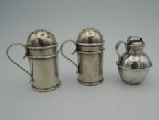 Three small silver sifters. The smallest 5 cm high (68.