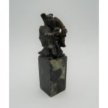 A soapstone figural seal. 10.5 cm high.