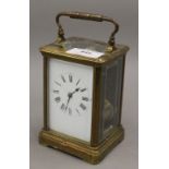 A brass cased carriage clock. 17 cm high.
