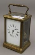 A brass cased carriage clock. 17 cm high.