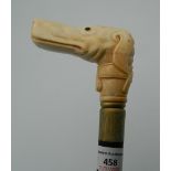 A bone carved walking stick formed as a dog. 94.5 cm long.