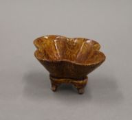 A Chinese pottery censer of quatrefoil form. 10 cm wide.