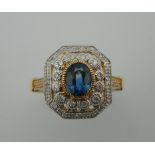 An Art Deco style 9 ct gold diamond and sapphire ring. Ring size L.