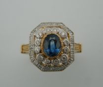 An Art Deco style 9 ct gold diamond and sapphire ring. Ring size L.