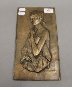 A bronze plaque depicting a girl, inscribed ''Giovagnoni''. 28.5 cm high.