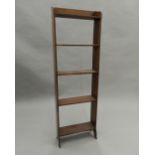 An Edwardian mahogany bookcase. 39 cm wide.