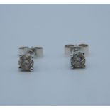 A pair of diamond ear studs