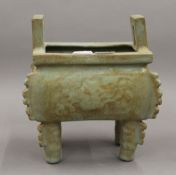 A Chinese celadon ground censer. 20 cm high.