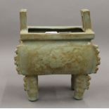 A Chinese celadon ground censer. 20 cm high.